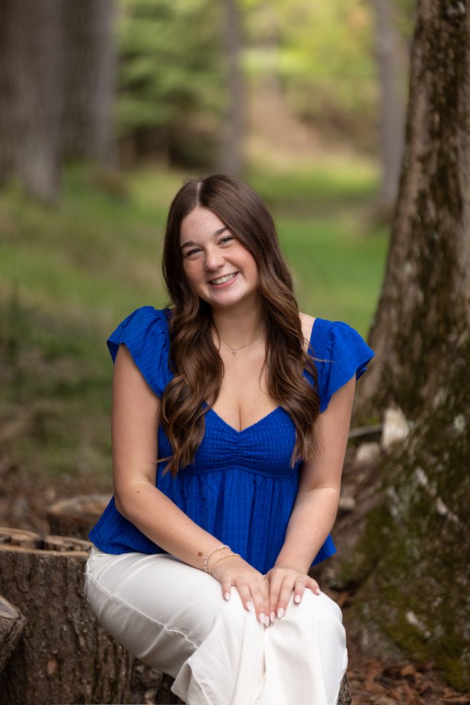 Julia's senior portrait in Hayward, WI, showcasing natural light and a relaxed pose.