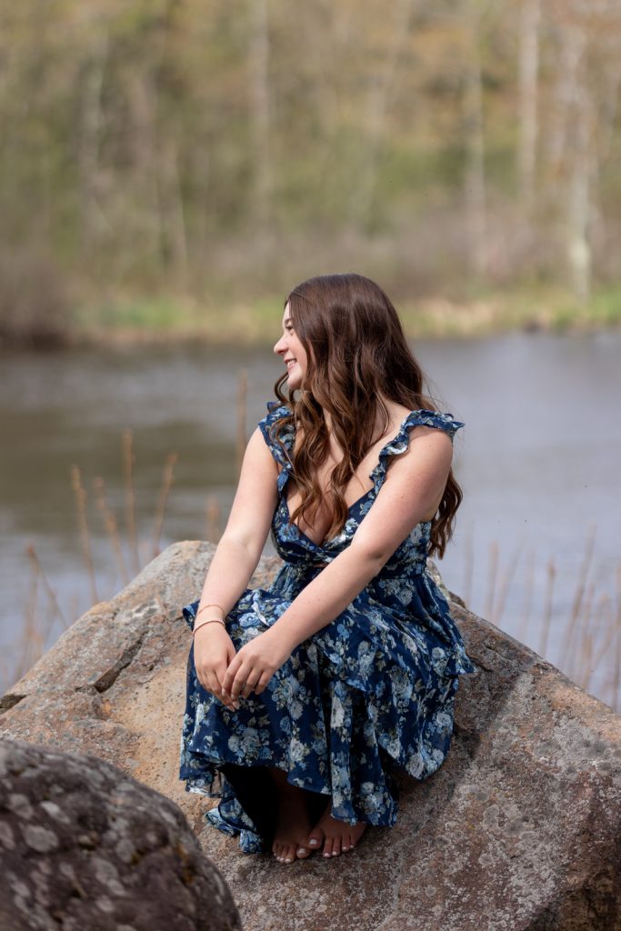 Julia's senior portrait session in Hayward, WI, featuring a smiling young woman in a blue
