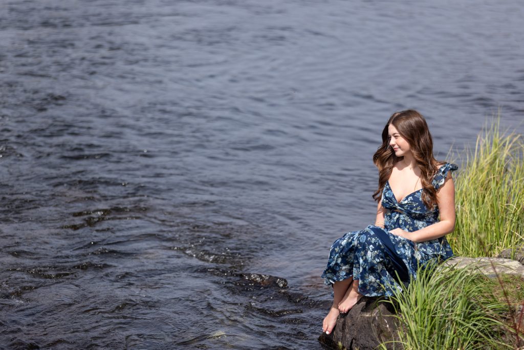 Julia's senior portrait session in Hayward, WI, lakeside portrait with flowing dress.