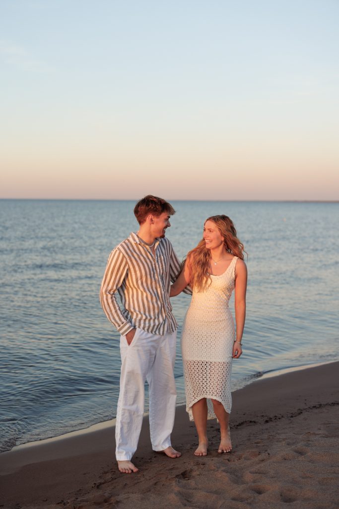 Senior portrait session in Duluth, Minnesota, featuring a smiling high school graduate and a friend