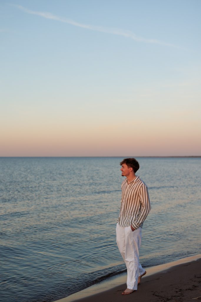 Jaymeson's senior portrait session on the beach in Duluth, Minnesota, showcasing senior photography services.