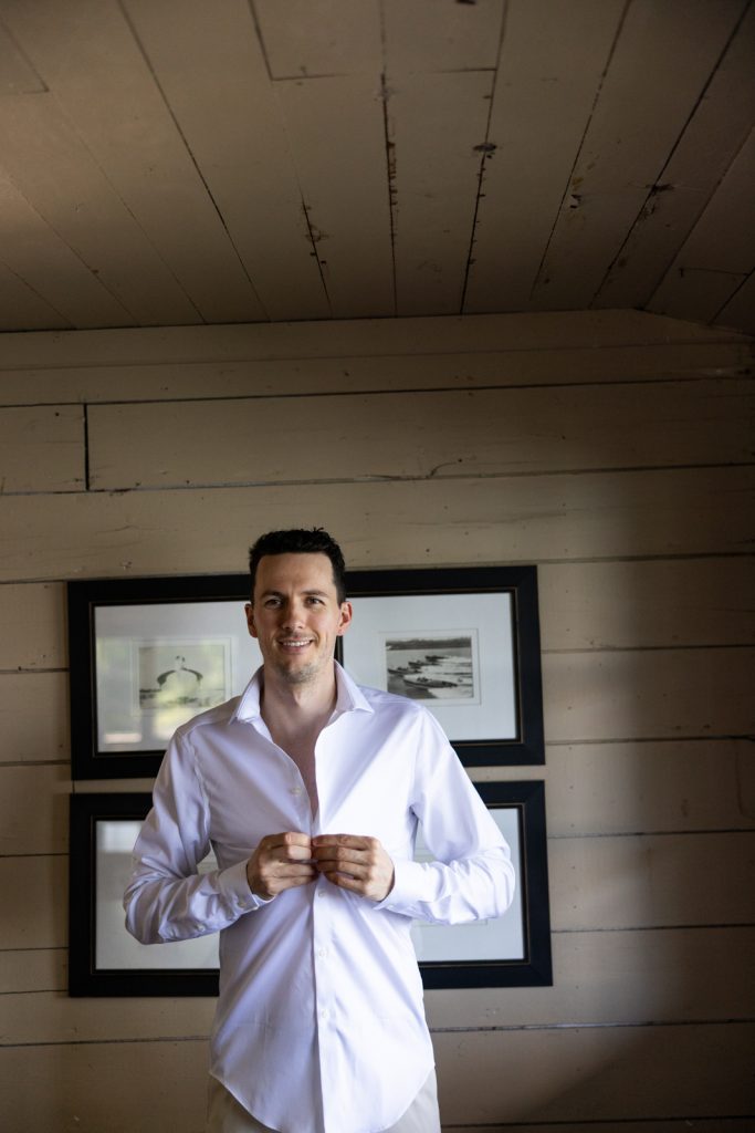 Groom getting ready at Stout’s Island Lodge, Birchwood, Wisconsin wedding photography.