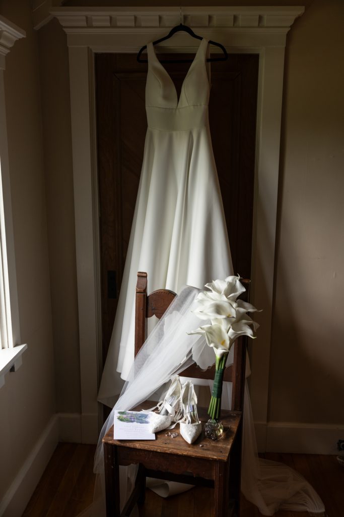 Brittany's wedding dress and bouquet of calla lilies on Stout’s Island, Wisconsin.