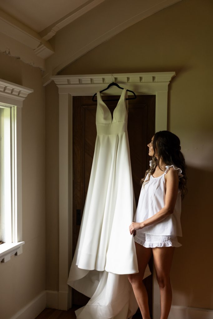 Brittany's wedding dress hanging in Stout’s Island resort, Birchwood, Wisconsin.