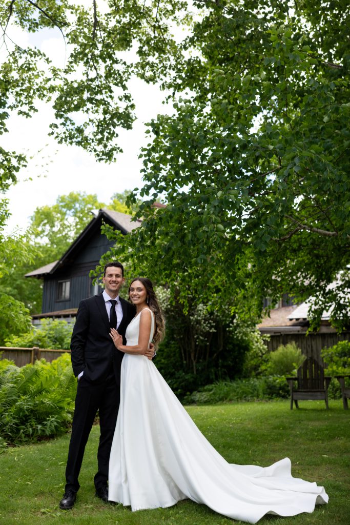 Brittany and Cole, the happy couple, posing at their Stout’s Island wedding in Birchwood, Wisconsin.