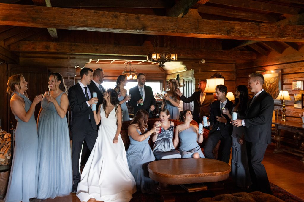 Brittany and Cole's wedding party gathered in the boat house at Stout’s Island Lodge, Birchwood,