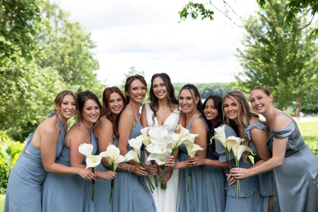Brittany and her bridesmaids with white calla lilies at Stout’s Island wedding in Wisconsin.