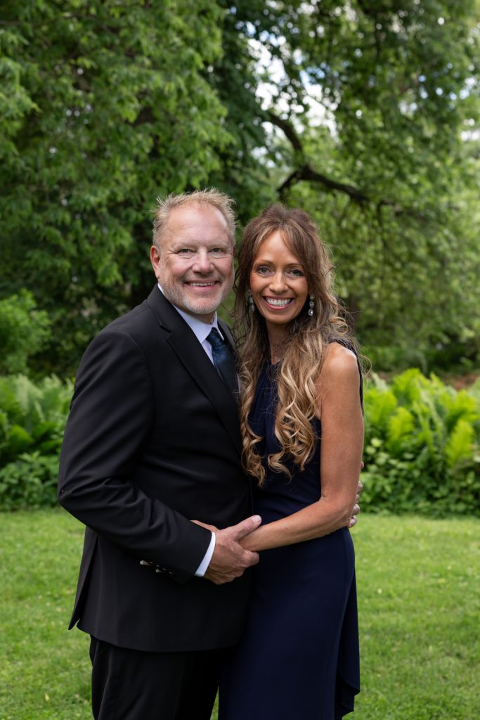 Brittany and Cole smiling portrait at Stout’s Island wedding in Wisconsin.