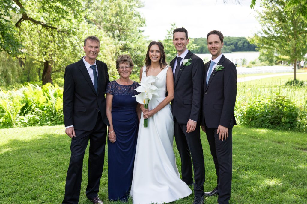 Brittany and Cole with family at Stout’s Island wedding in Birchwood, Wisconsin.