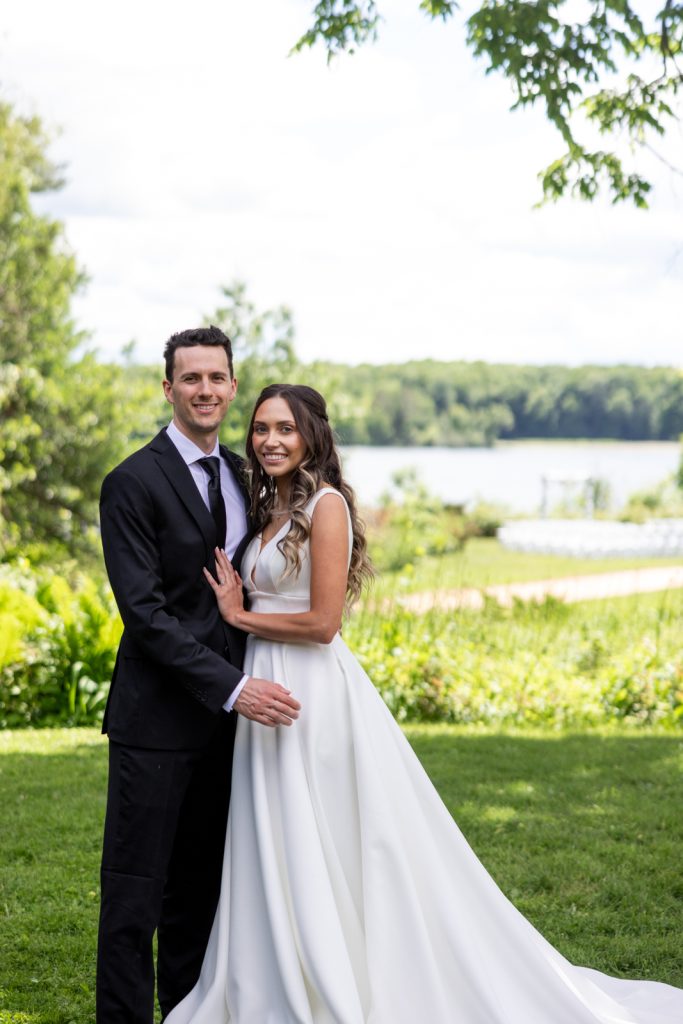Brittany and Cole, the happy couple, posing on Stout’s Island in Wisconsin, a Red Cedar