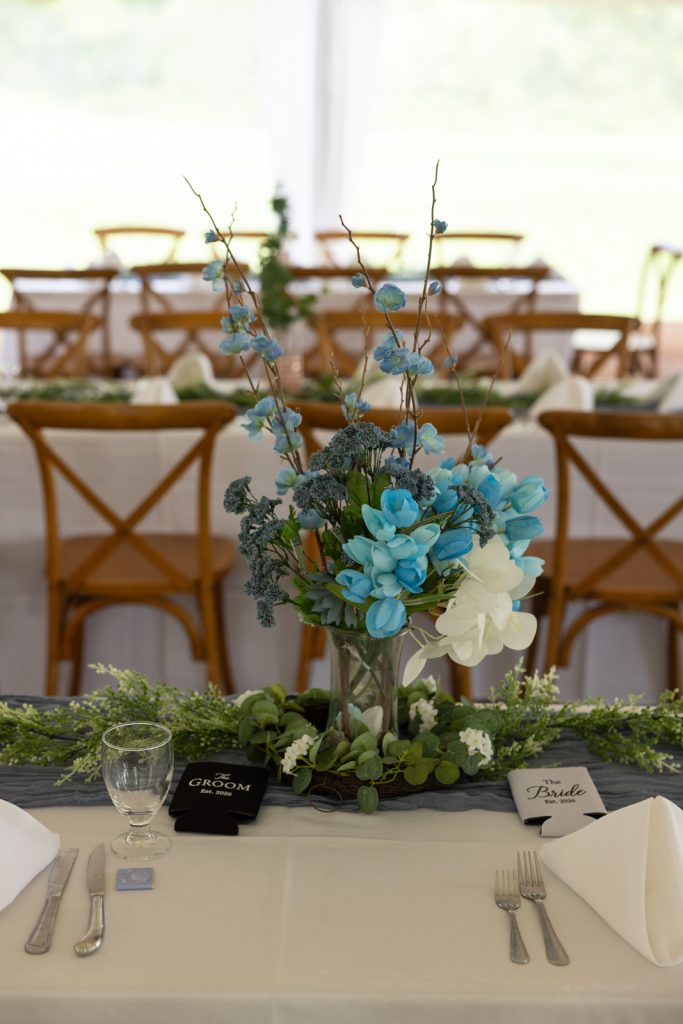 Blue and white floral centerpiece on Stout’s Island wedding tablescape.