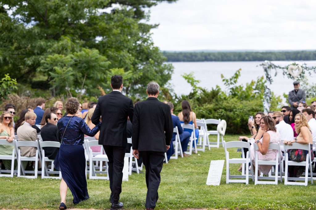 Brittany and Cole’s Stout’s Island wedding ceremony overlooking Red Cedar Lake, Wisconsin.