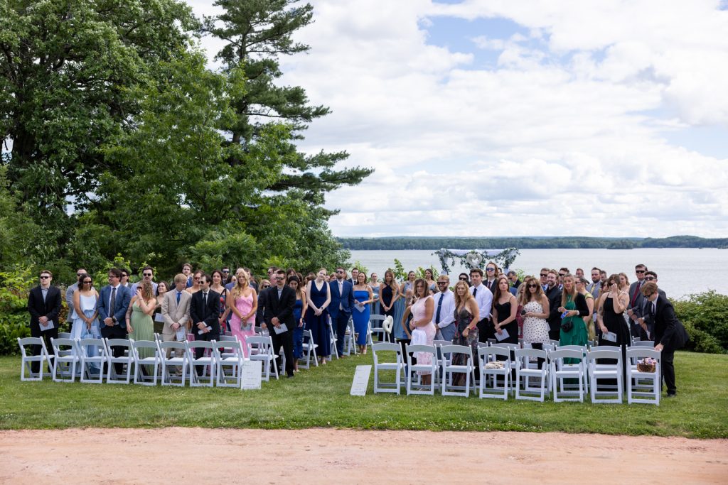Brittany and Cole's wedding guests gathered on Stout’s Island, Wisconsin, overlooking Red Cedar Lake.