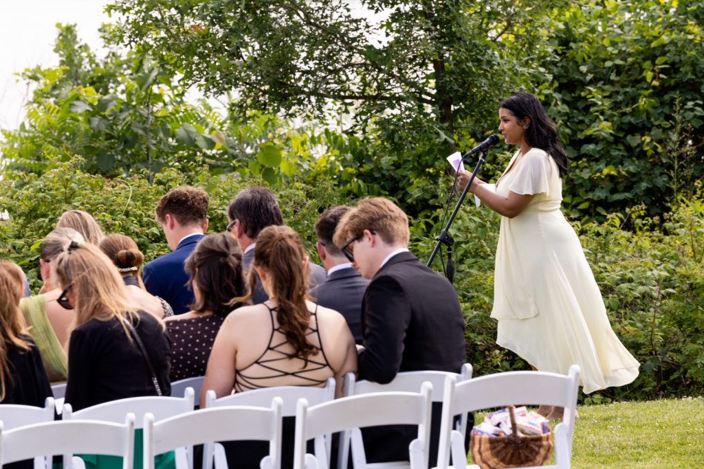 Bride reading vows at Stout’s Island wedding ceremony and reception.