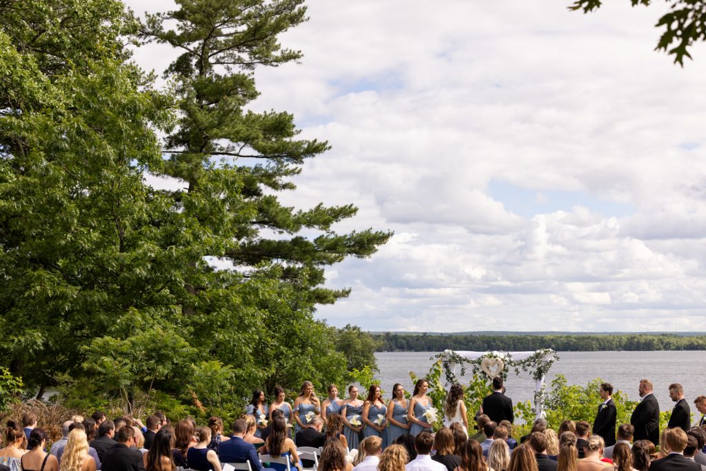 Brittany and Cole’s Stout’s Island wedding ceremony overlooking Red Cedar Lake in Wisconsin.