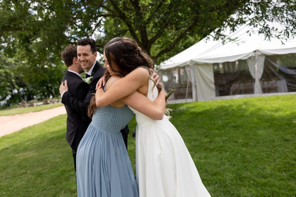 Brittany and Cole embracing at their Stout’s Island wedding in Birchwood, Wisconsin.