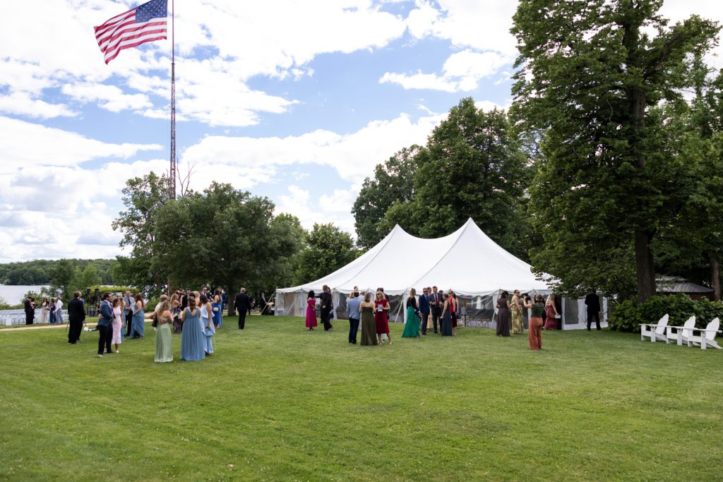 Stout’s Island wedding reception with guests and American flag, Birchwood Wisconsin.