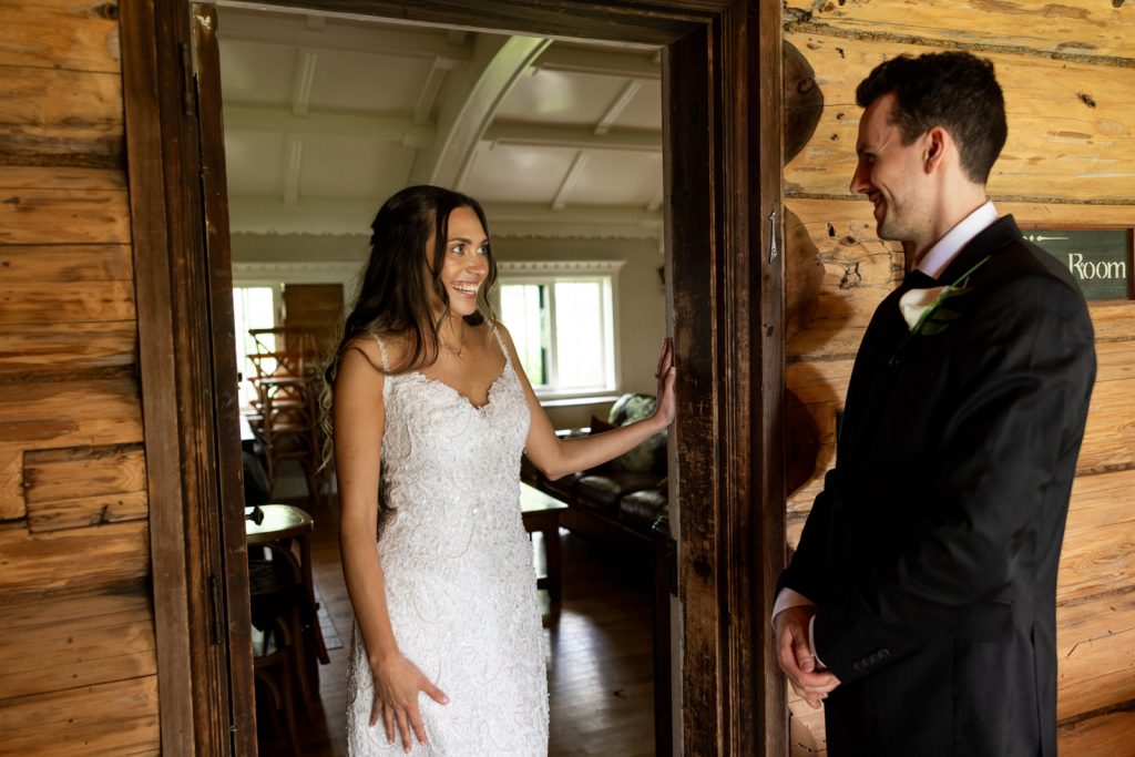Bride and groom sharing a joyful first look at Stout’s Island wedding in Birchwood, Wisconsin.