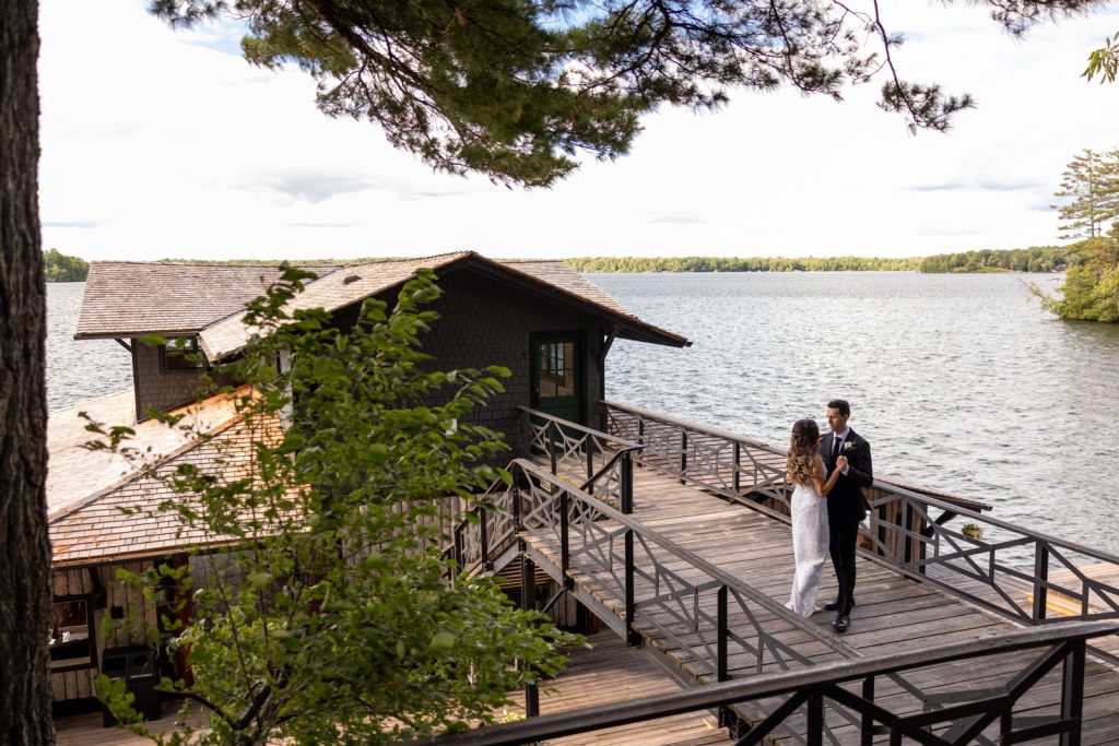 Brittany and Cole dancing on Stout’s Island Lodge boat house overlooking Red Cedar Lake, Wisconsin