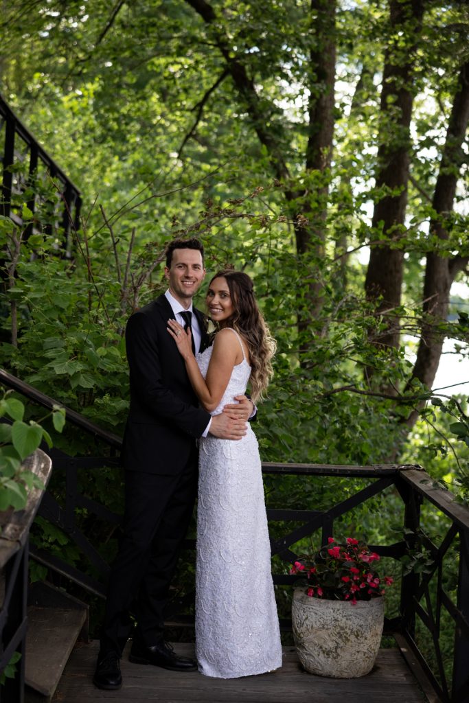 Brittany and Cole, wedding couple, posing on Stout’s Island stairs, Birchwood, Wisconsin.
