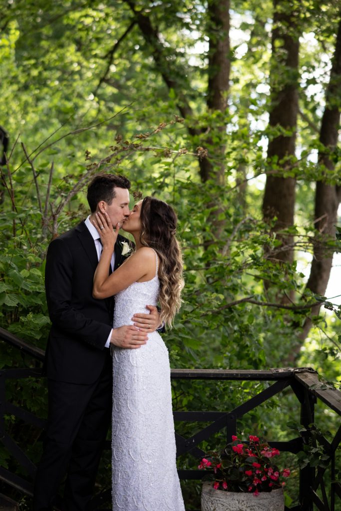 Brittany and Cole kissing on Stout’s Island, Wisconsin wedding photography and videography by Superior Sunset