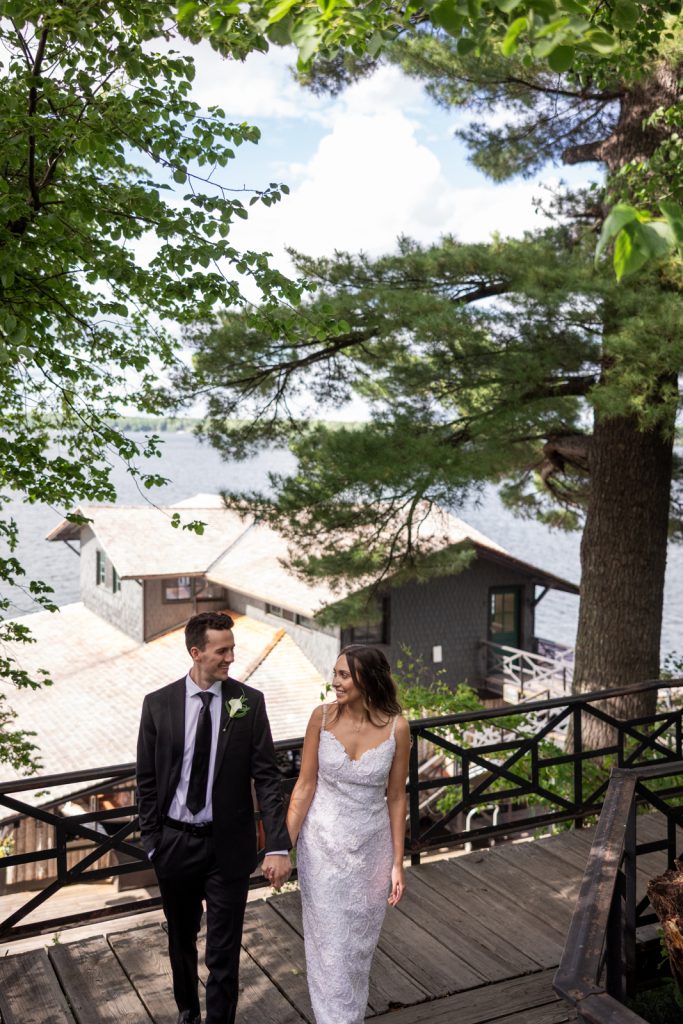 Brittany and Cole, wedding couple, walking on Stout’s Island, Red Cedar Lake, Wisconsin.