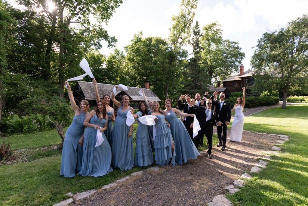 Brittany and Cole’s wedding party celebrating at Stout’s Island Lodge in Birchwood, Wisconsin.