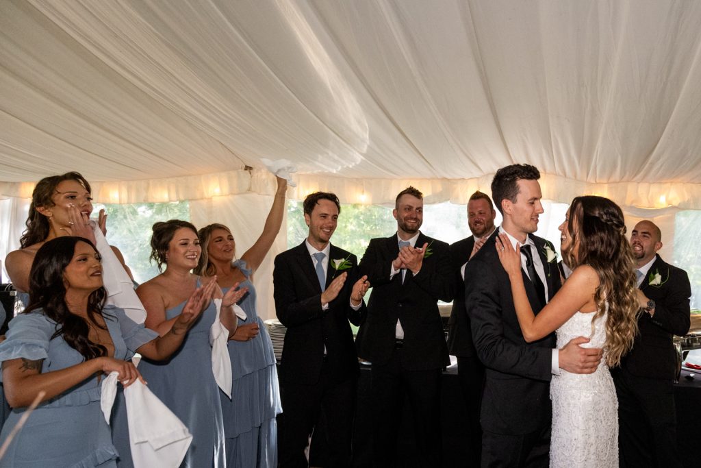 Brittany and Cole celebrating wedding reception at Stout’s Island Lodge, Birchwood, Wisconsin.