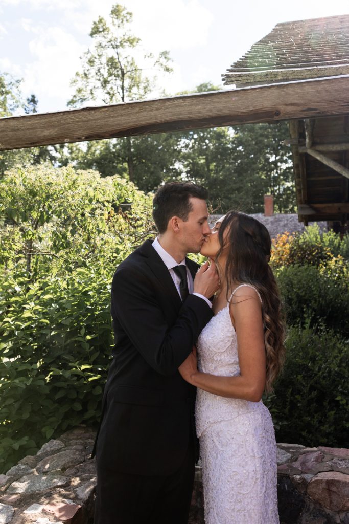 Brittany and Cole kissing at their Stout’s Island wedding in Birchwood, Wisconsin.