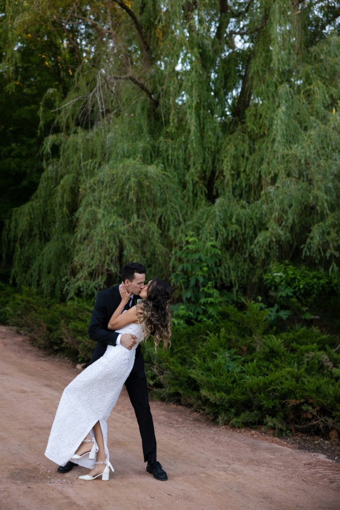 Brittany and Cole kissing on Stout’s Island, Wisconsin wedding photography.