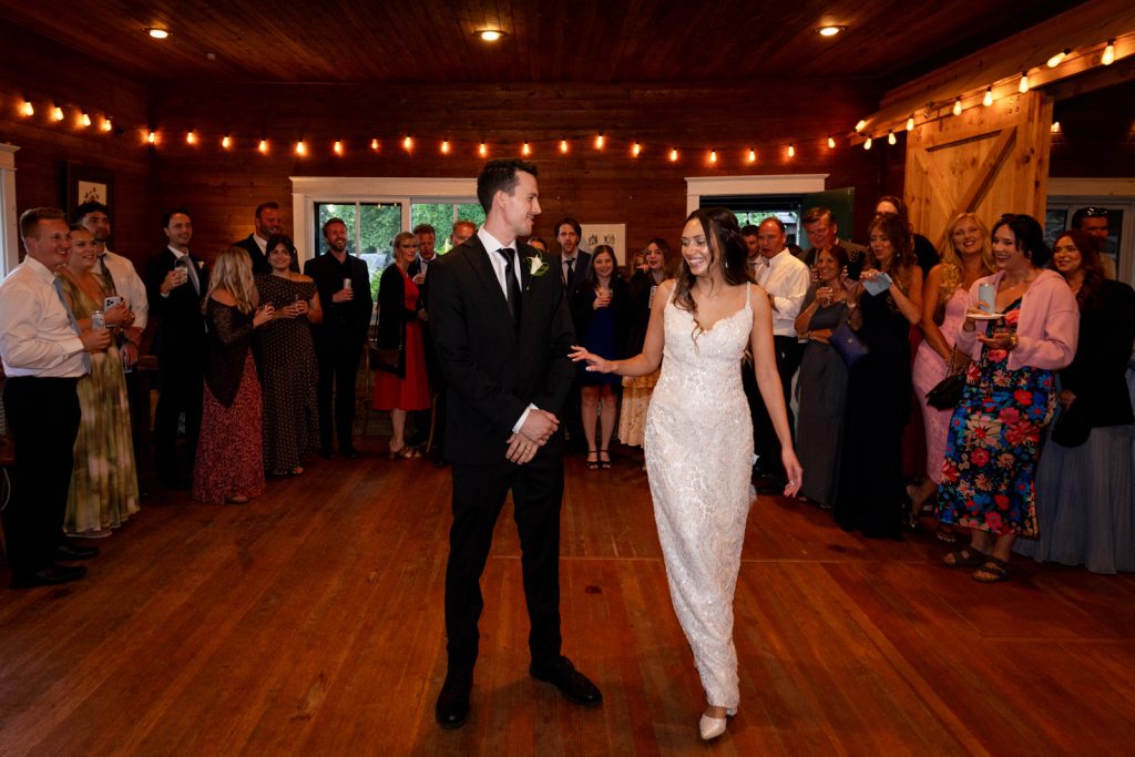 Brittany and Cole wedding reception at Stout’s Island Lodge, Birchwood, Wisconsin, with guests celebrating.