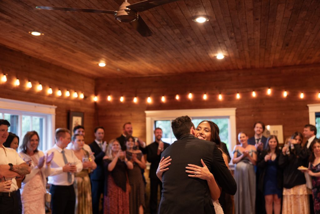 Brittany and Cole sharing a romantic dance at Stout’s Island wedding reception, Wisconsin.