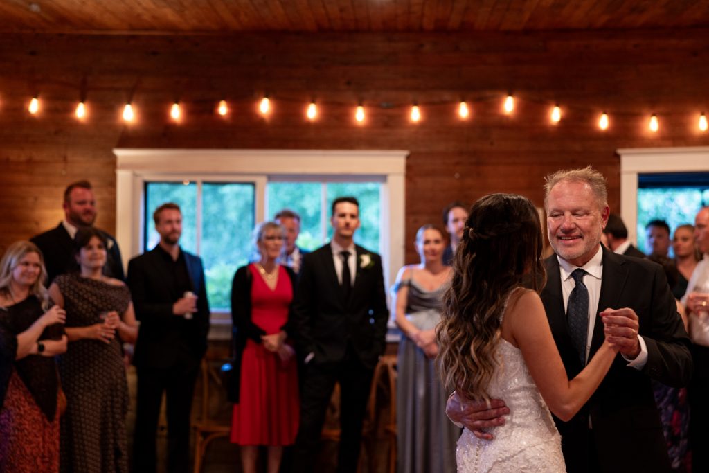 Bride and father dancing at Stout’s Island wedding reception in Birchwood, Wisconsin.