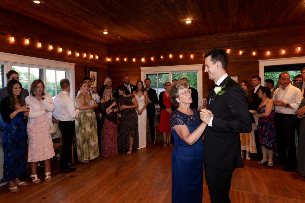 Brittany and Cole's Stout’s Island wedding reception with dancing and celebration in the boat house.