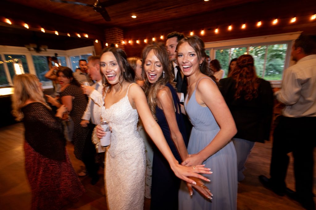 Brittany the bride and wedding party dancing at Stout’s Island Lodge wedding reception.