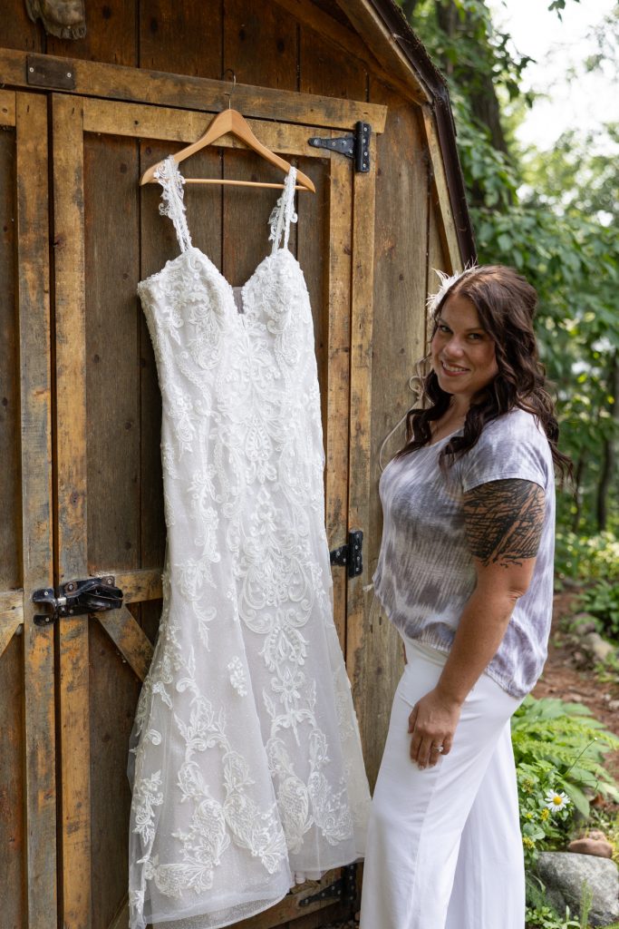 Bride's wedding dress hanging on cabin door, Hayward, WI wedding photography.
