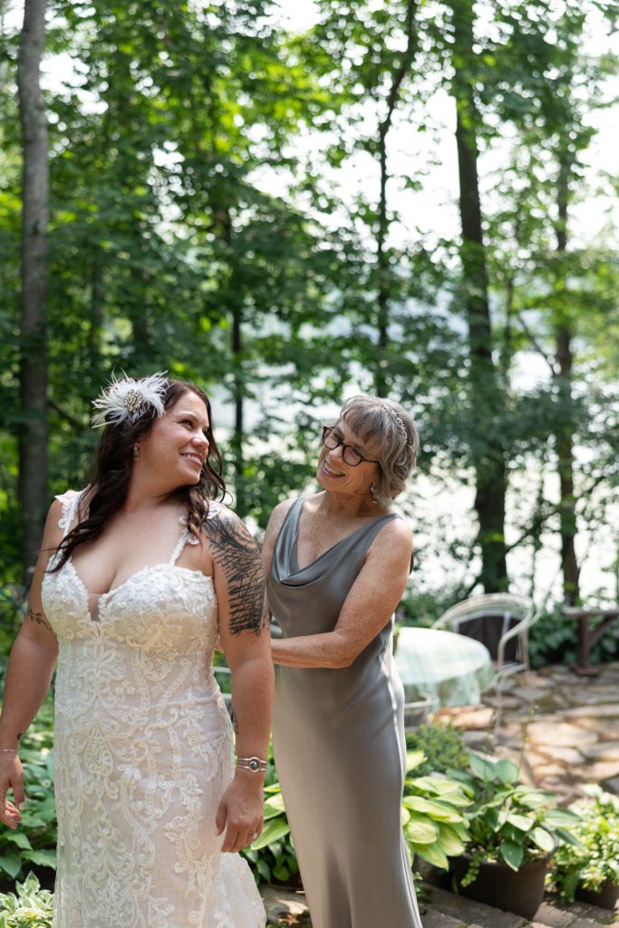 Bride and mother sharing a moment at a lakeside wedding in Hayward, WI.