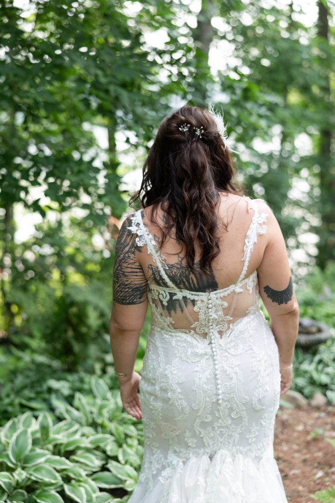 Bride in wedding dress walking toward lake, Hayward, WI wedding photography.