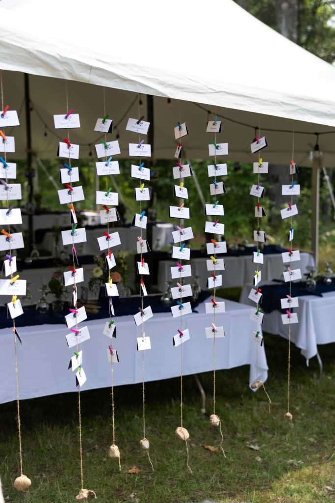 Wedding seating chart display at a lakeside cabin wedding in Hayward, WI.