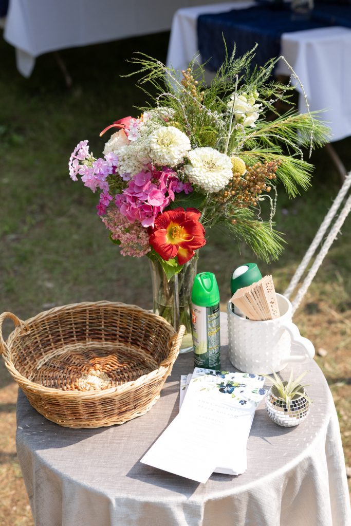Wedding floral arrangement and table setting at a family cabin in Hayward, WI.