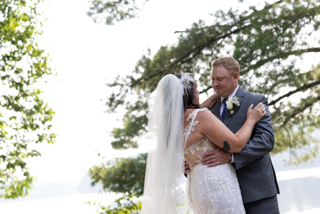 Bride and groom dancing at lake-side wedding in Hayward, WI