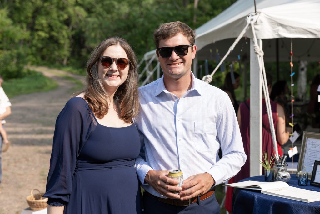 Bride and groom smiling at their Hayward, WI wedding celebration.