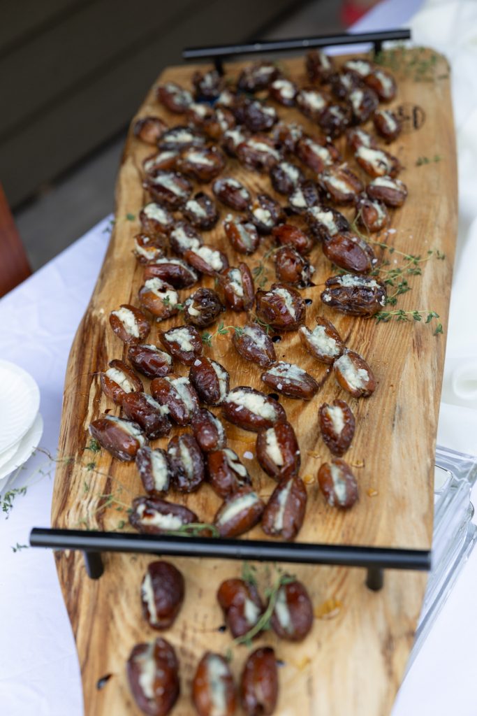 Stuffed dates on wooden board, delicious Five Course Catering food at Hayward, WI wedding.