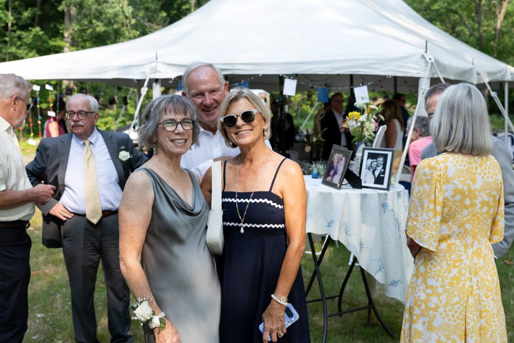 Wedding guests celebrating at a lakeside cabin in Hayward, WI.