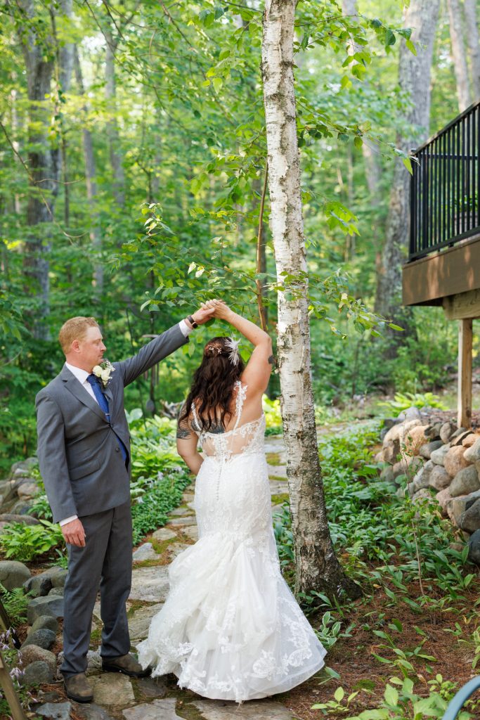 Bride and groom dancing at lakeside cabin wedding in Hayward, WI