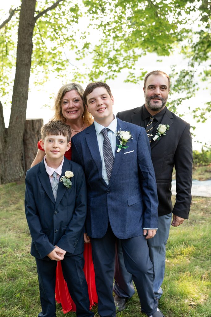 Family portrait at Hayward, WI wedding ceremony by the lake