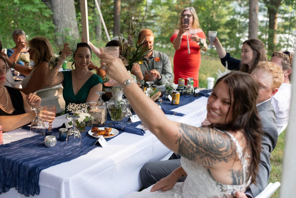 Bride and guests toasting at a backyard wedding in Hayward, WI.