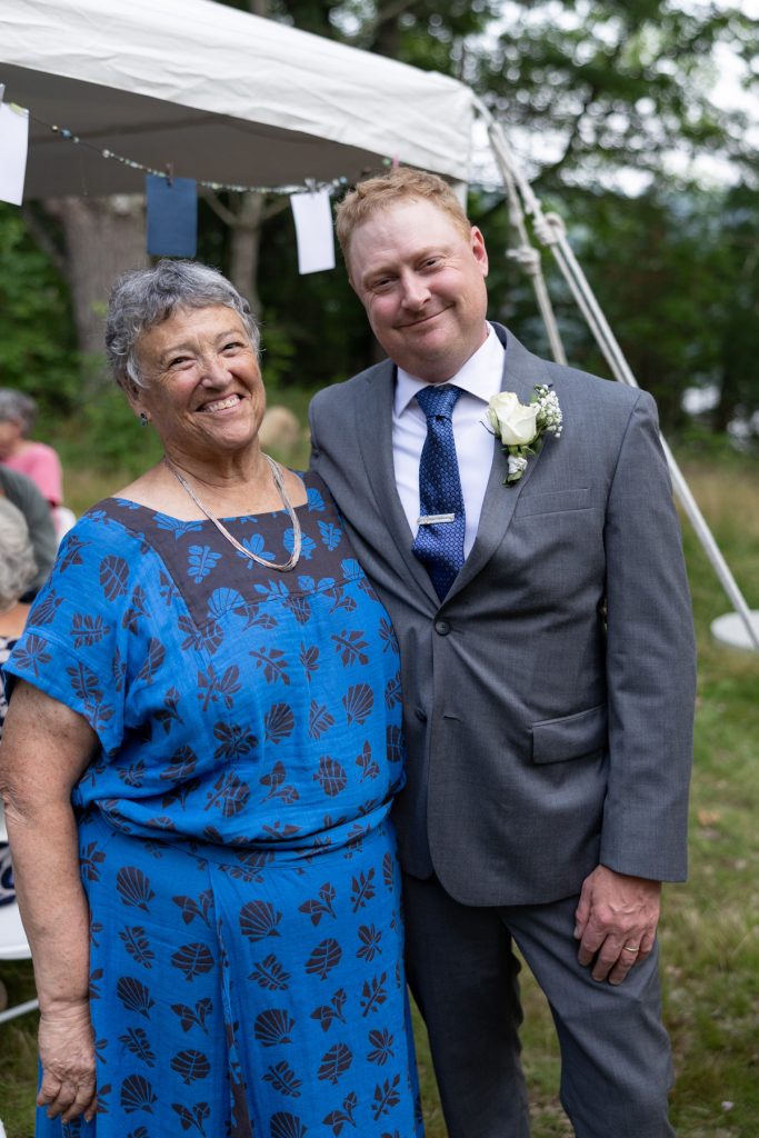 Bride and groom with family at a backyard wedding in Hayward, WI