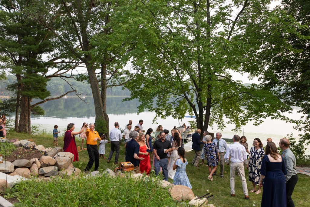 Wedding guests celebrating at a lakeside cabin in Hayward, Wisconsin.
