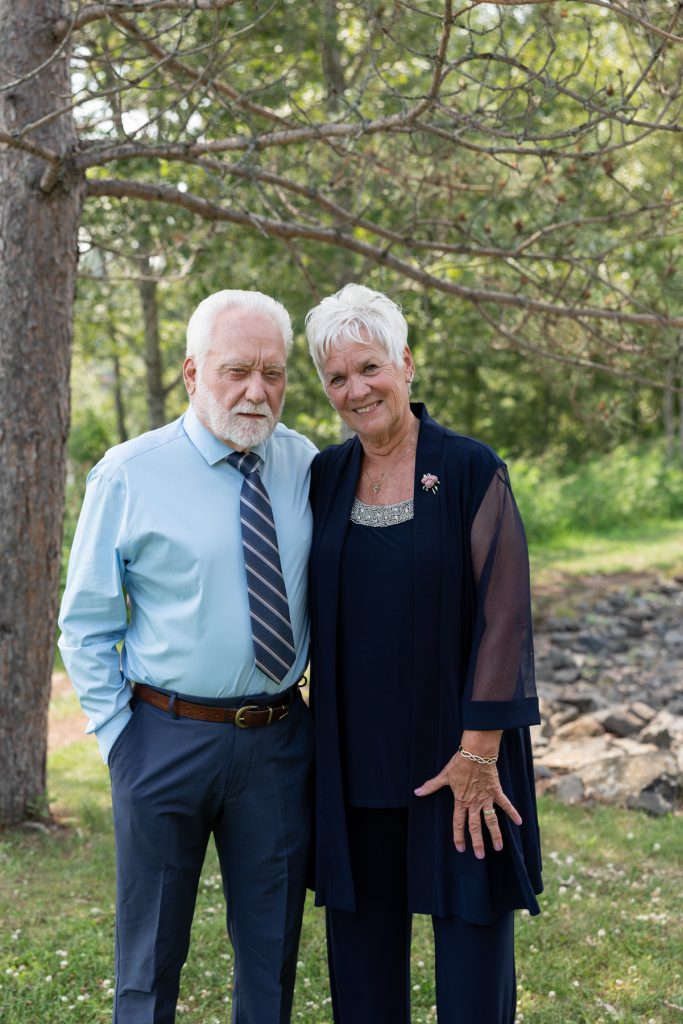 Elderly couple posing for wedding photography in Hayward, Wisconsin, showcasing Beau Petersen Photography’s wedding